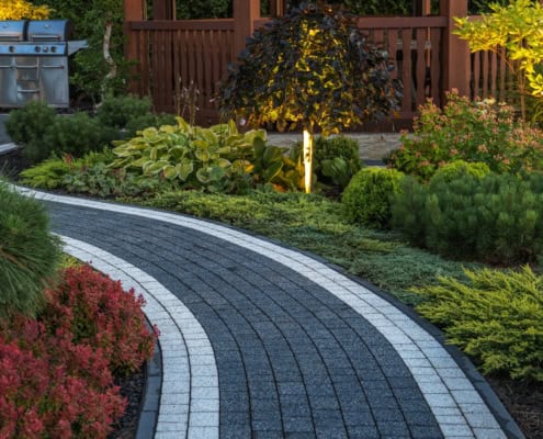 Hardscaping concept: Concrete Brick Garden Pathway and Beautiful LED Illuminated Back Yard Garden