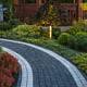 Hardscaping concept: Concrete Brick Garden Pathway and Beautiful LED Illuminated Back Yard Garden