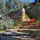 Photo of masonry in backyard with flowers and landscaping